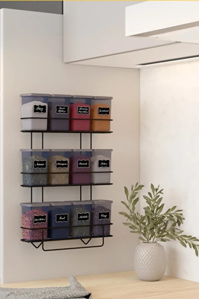 Kitchen counter with black wire spice racks and fruit basket